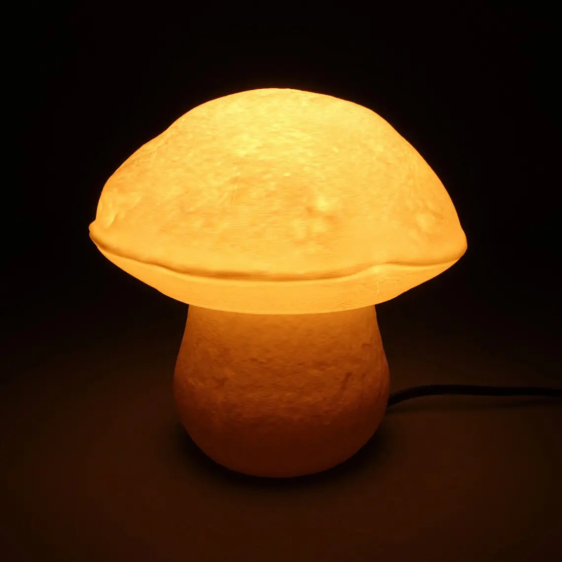 Edulis Fungus Table Lamp - Small Organic Mushroom Design in cotton white color turned on.