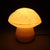 Edulis Fungus Table Lamp - Small Organic Mushroom Design in cotton white color turned on.