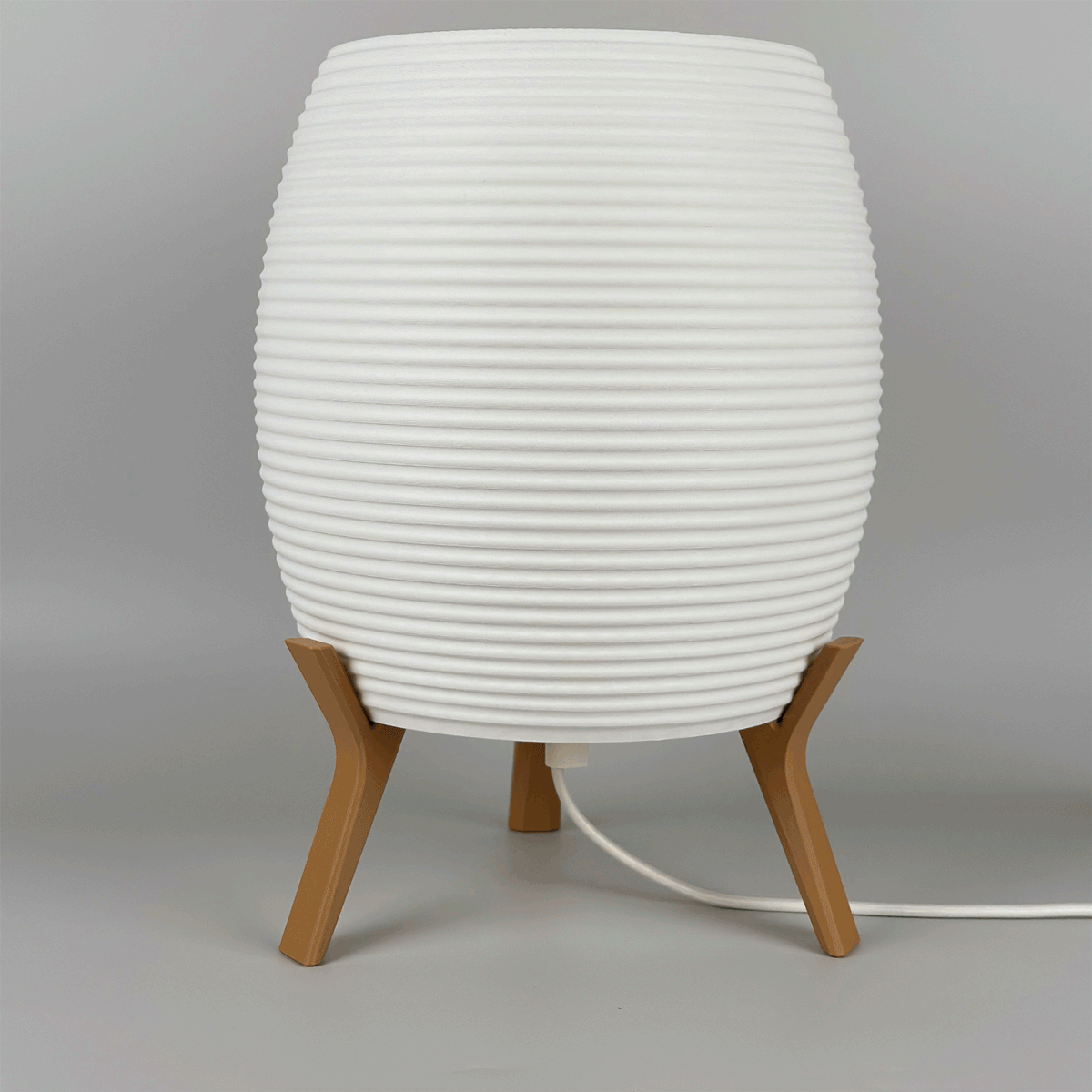 MinimalElegance Curve Table Lamp - Minimalist Bedside lamp in cotton white shade and wood brown base. Lamp is turned on and off.