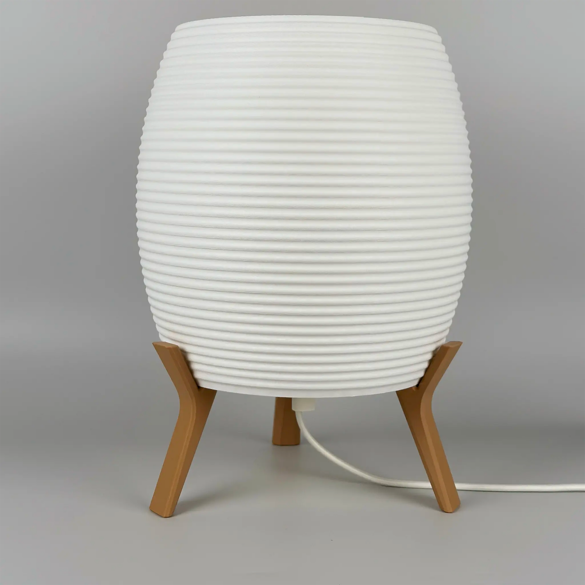 MinimalElegance Curve Table Lamp - Minimalist Bedside lamp in cotton white shade and wood brown base. Lamp is turned off.