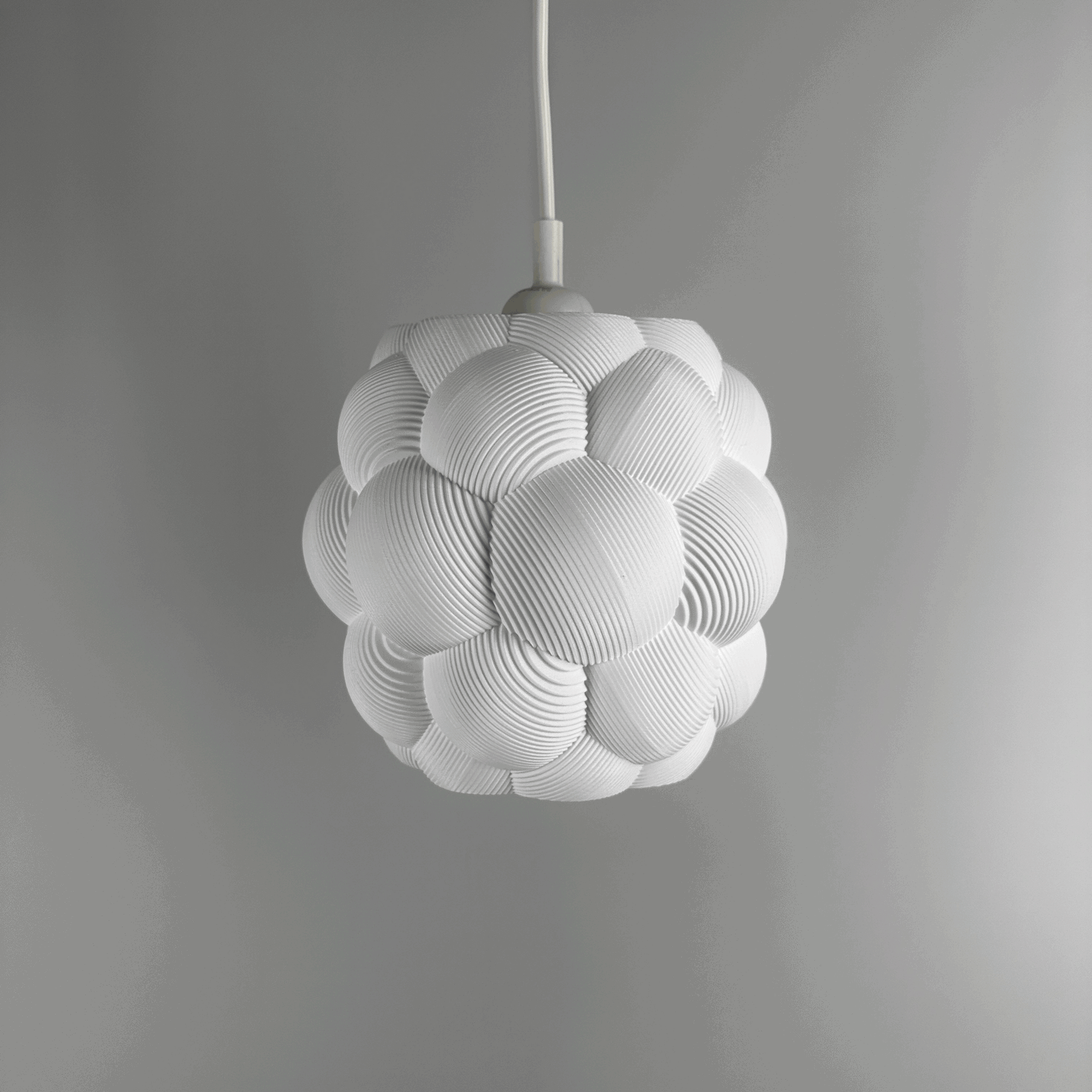 3D printed Apo Malli lampshade in modern design in cotton white biodegradable material. Used with 400k LED bulb on and off