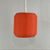 Lucash lampshade in muted red- onn and off, adding a vibrant touch to modern home settings with its unique 3D printed structure.